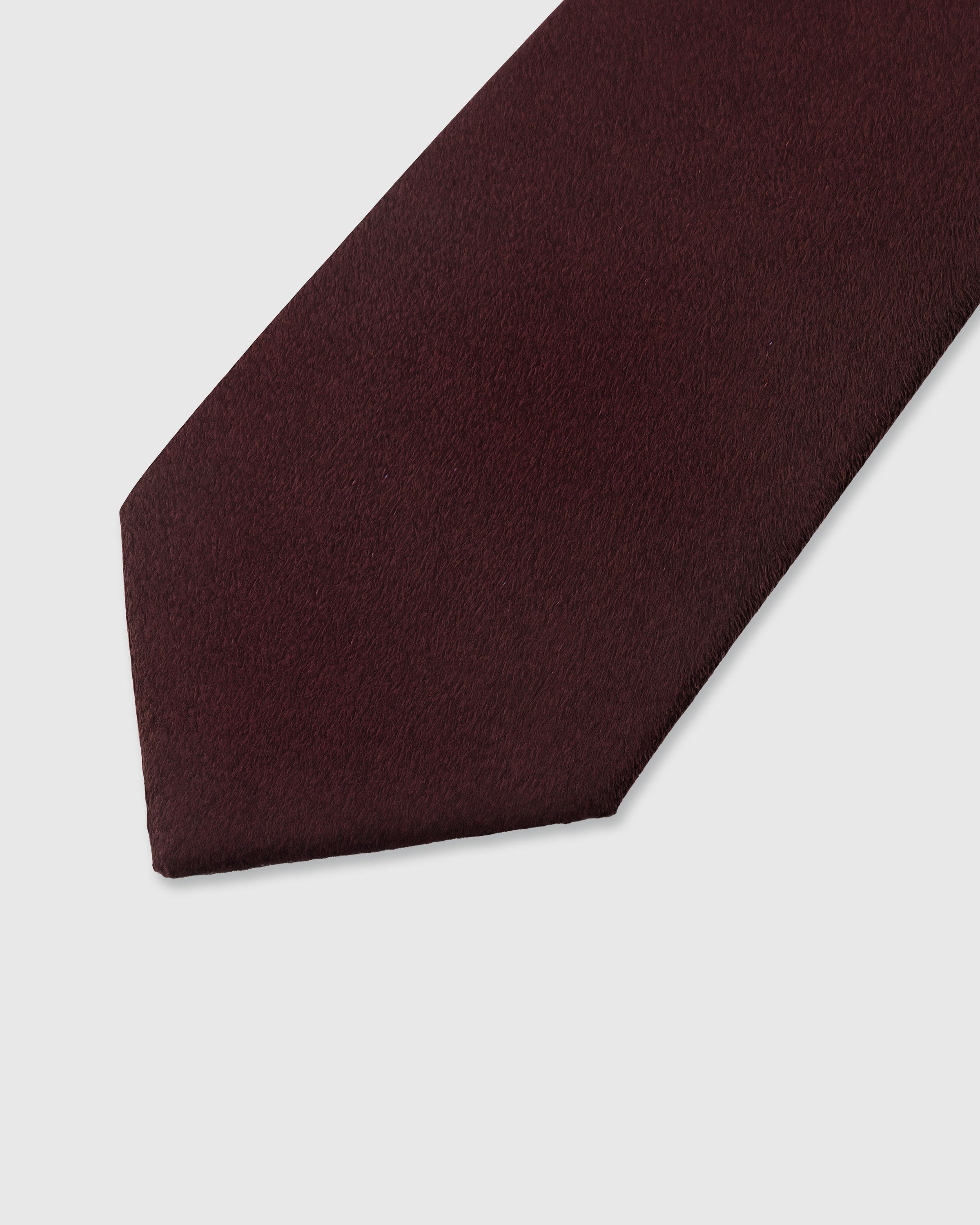 {Solid oxblood tonal texture} Solid detail on oxblood mulberry silk tie showing embroidered pattern by STICKYZOO