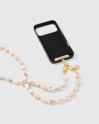 Full phone with blush marble link strap draped alongside on neutral background