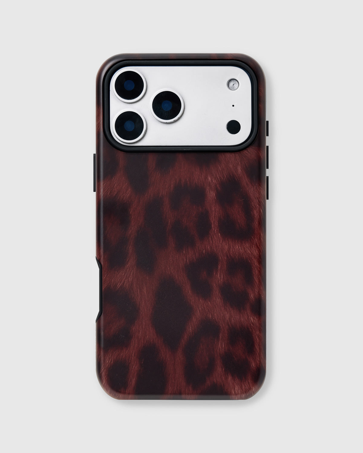 Back of the iris aperture phone case showing burgundy leopard rosettes on matte UV-printed ABS