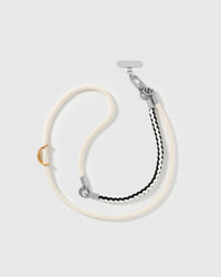 Full length of the adjustable ivory braided strap worn cross-body or over the shoulder — rated 4.9 across 5,000+ reviews
