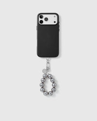 Handmade beaded phone strap on a black case, rated 4.9 across 5,000+ reviews