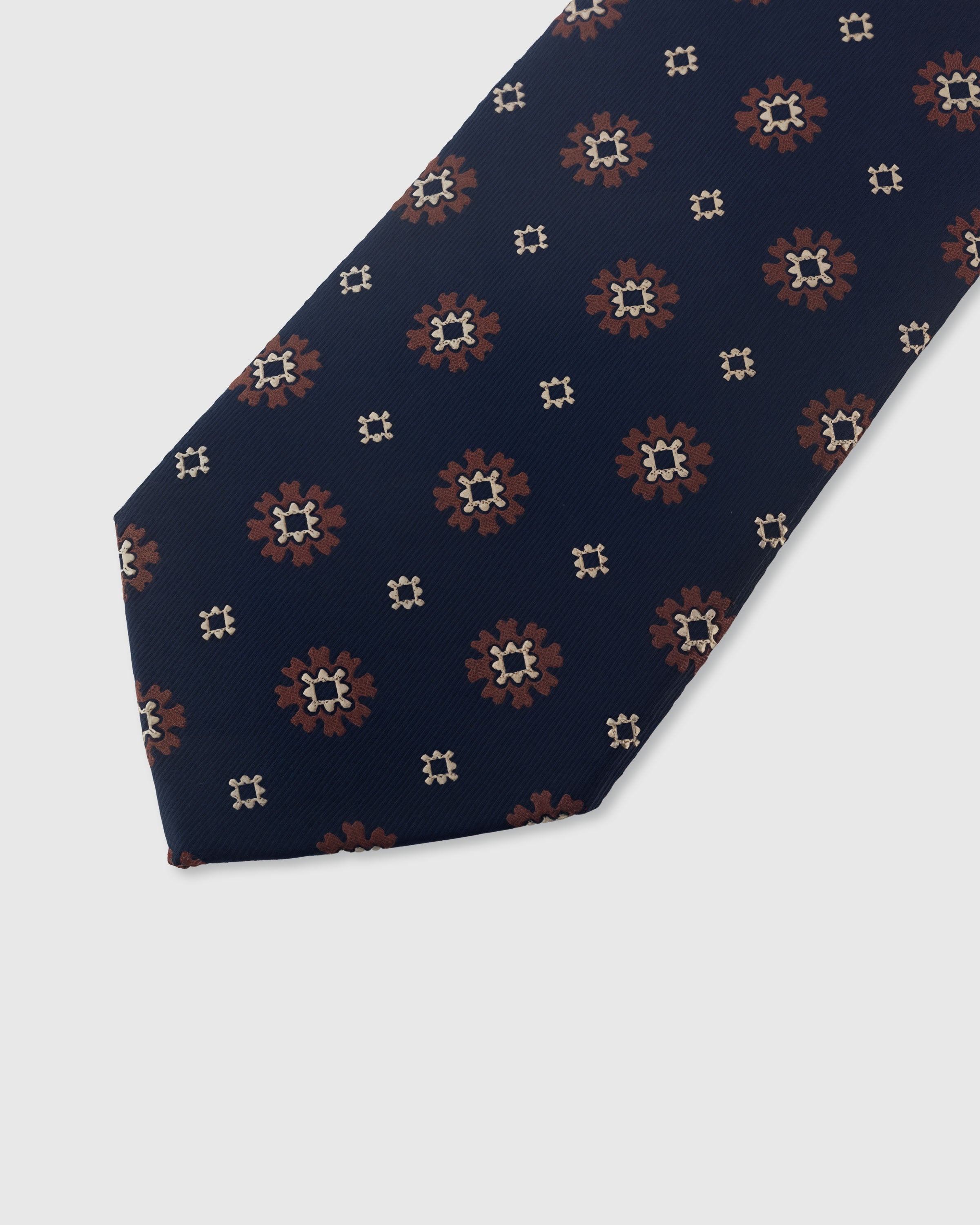 {Embroidered star-burst foulard detail} Foulard detail on midnight navy mulberry silk tie showing embroidered pattern by STICKYZOO