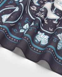 Close-up of the hop-vine border on the campfire critters silk scarf showing the soft drape of pure silk