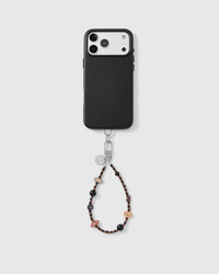 Handmade beaded phone strap on a black case, rated 4.9 across 5,000+ reviews
