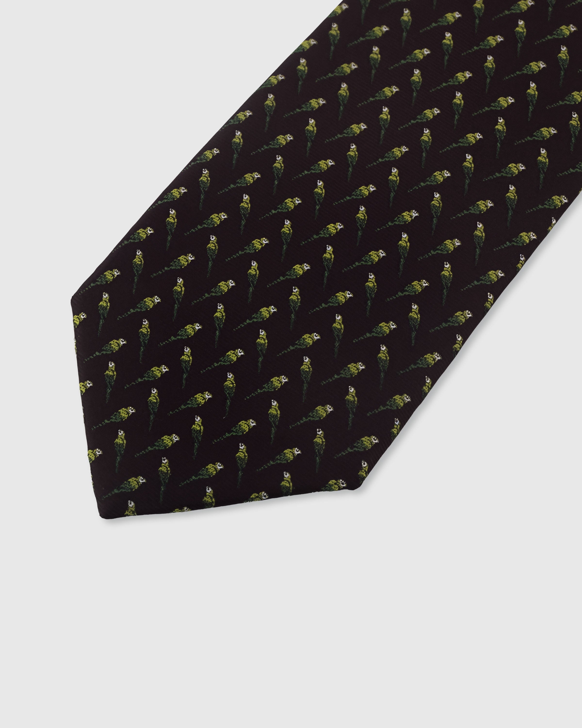 {Embroidered parakeet bird motif detail} Parakeet detail on plum mulberry silk tie showing embroidered pattern by STICKYZOO