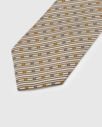 Amber and blue dot detail on striped ivory mulberry silk tie showing hand-embroidered thread work by STICKYZOO