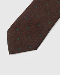 Emerald green pin dot detail on tobacco mulberry silk tie showing raised hand-embroidered thread by STICKYZOO