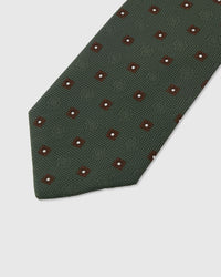 Claret foulard dot detail on forest mulberry silk tie showing raised hand-embroidered thread by STICKYZOO
