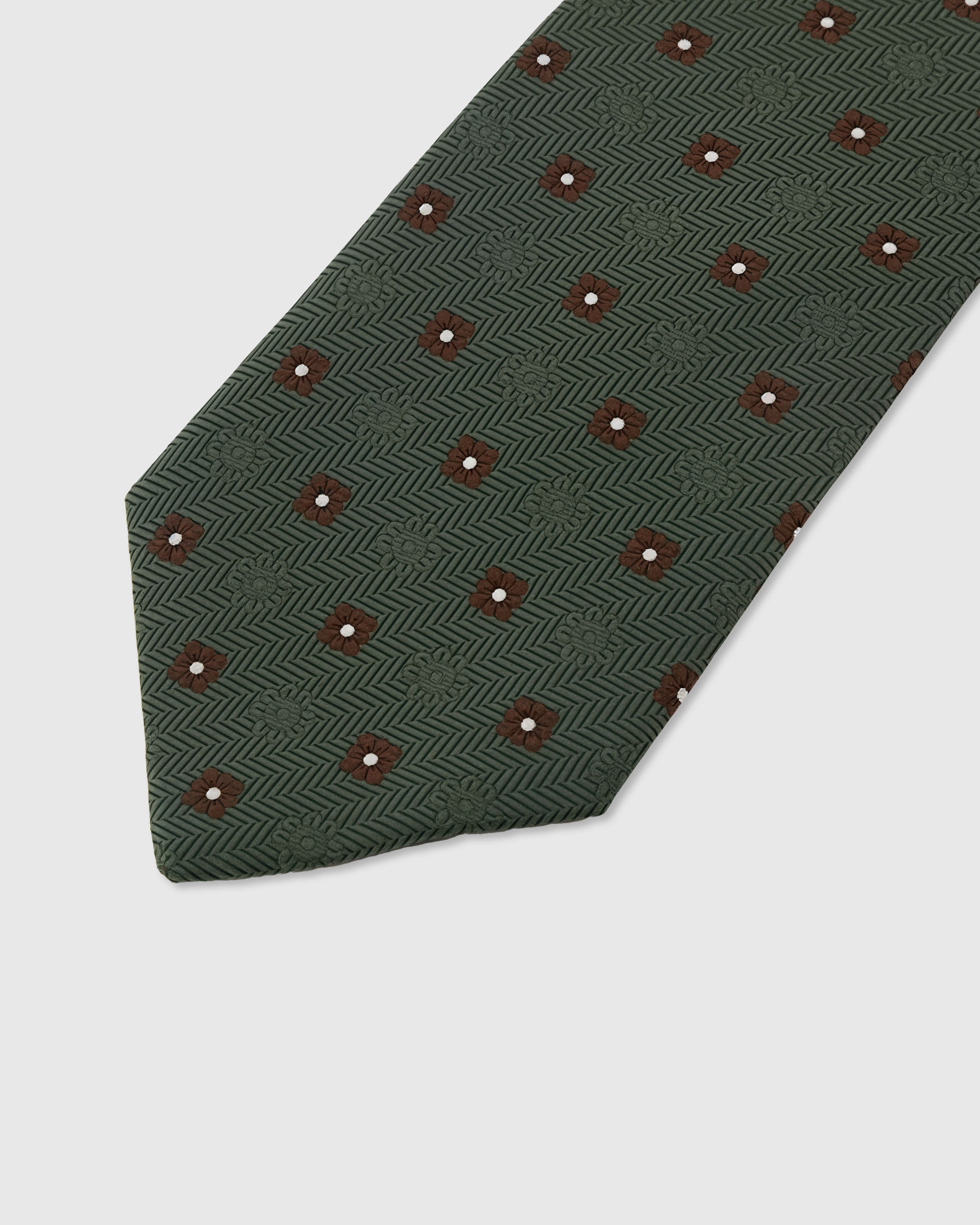 Claret foulard dot detail on forest mulberry silk tie showing raised hand-embroidered thread by STICKYZOO