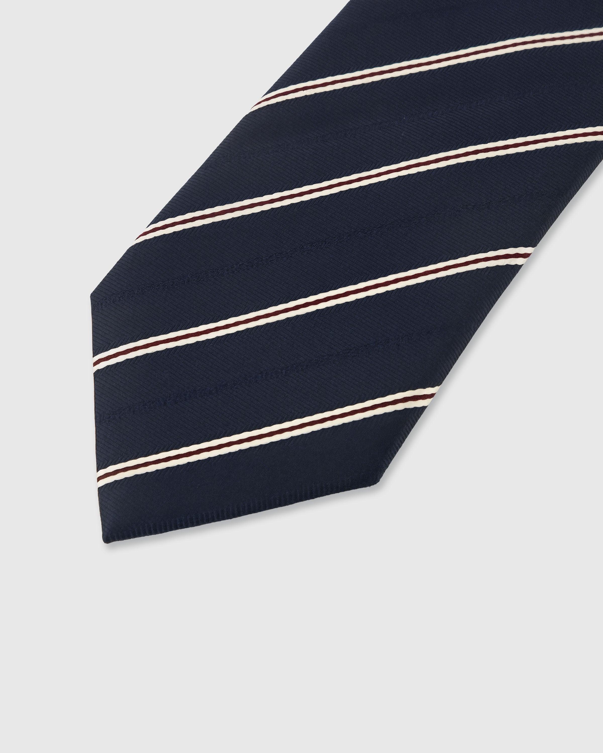 {Embroidered regimental stripe detail} Regimental stripe detail on midnight navy mulberry silk tie showing embroidered pattern by STICKYZOO