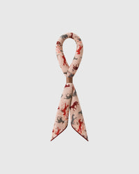 STICKYZOO galloping horses silk scarf looped through a leather ring showing the printed motif