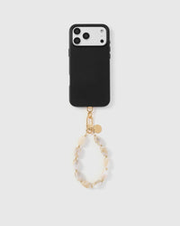 Full phone with ivory marble stone strap attached on grey background