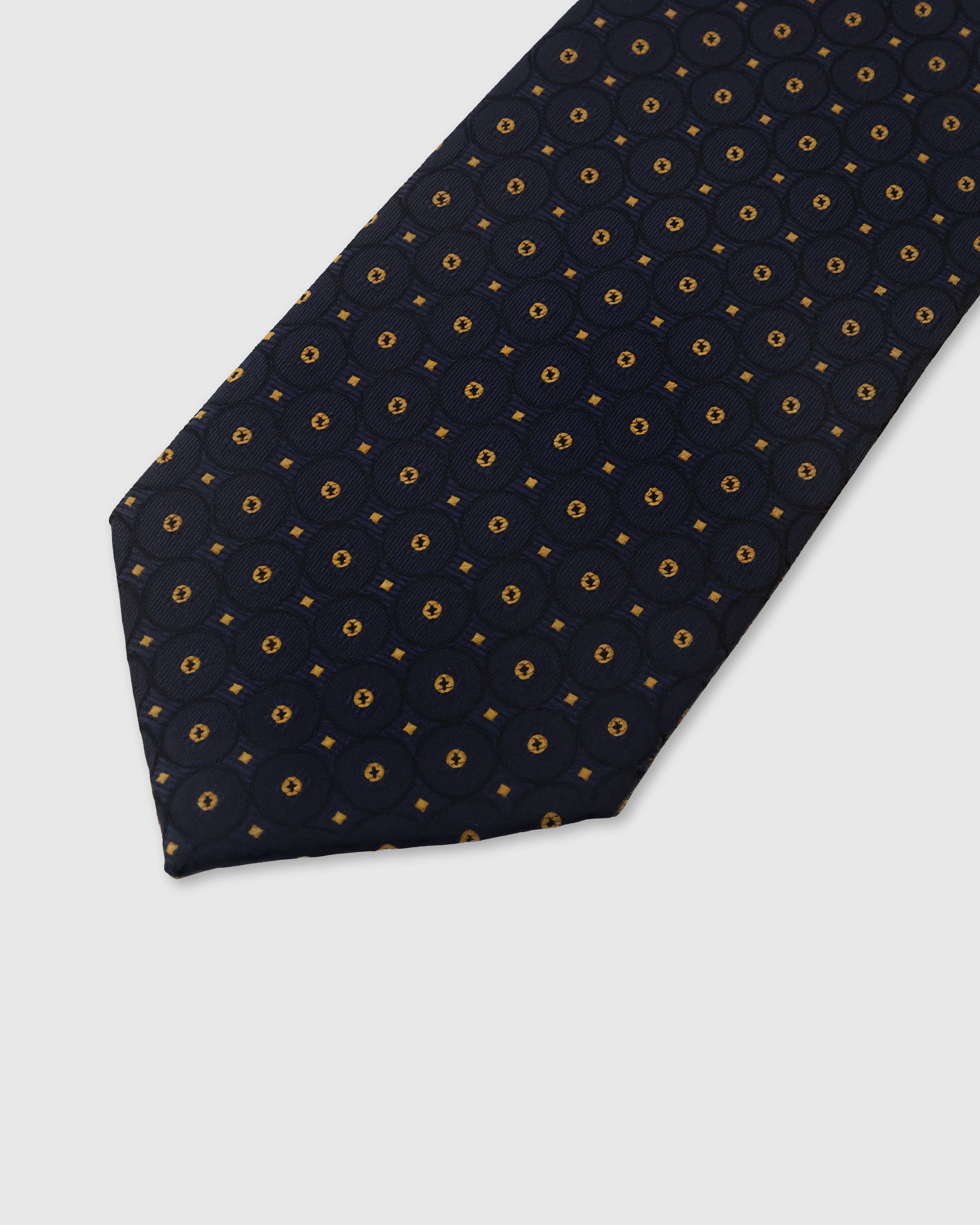 Gold medallion dot detail on midnight mulberry silk tie showing hand-embroidered raised thread by STICKYZOO