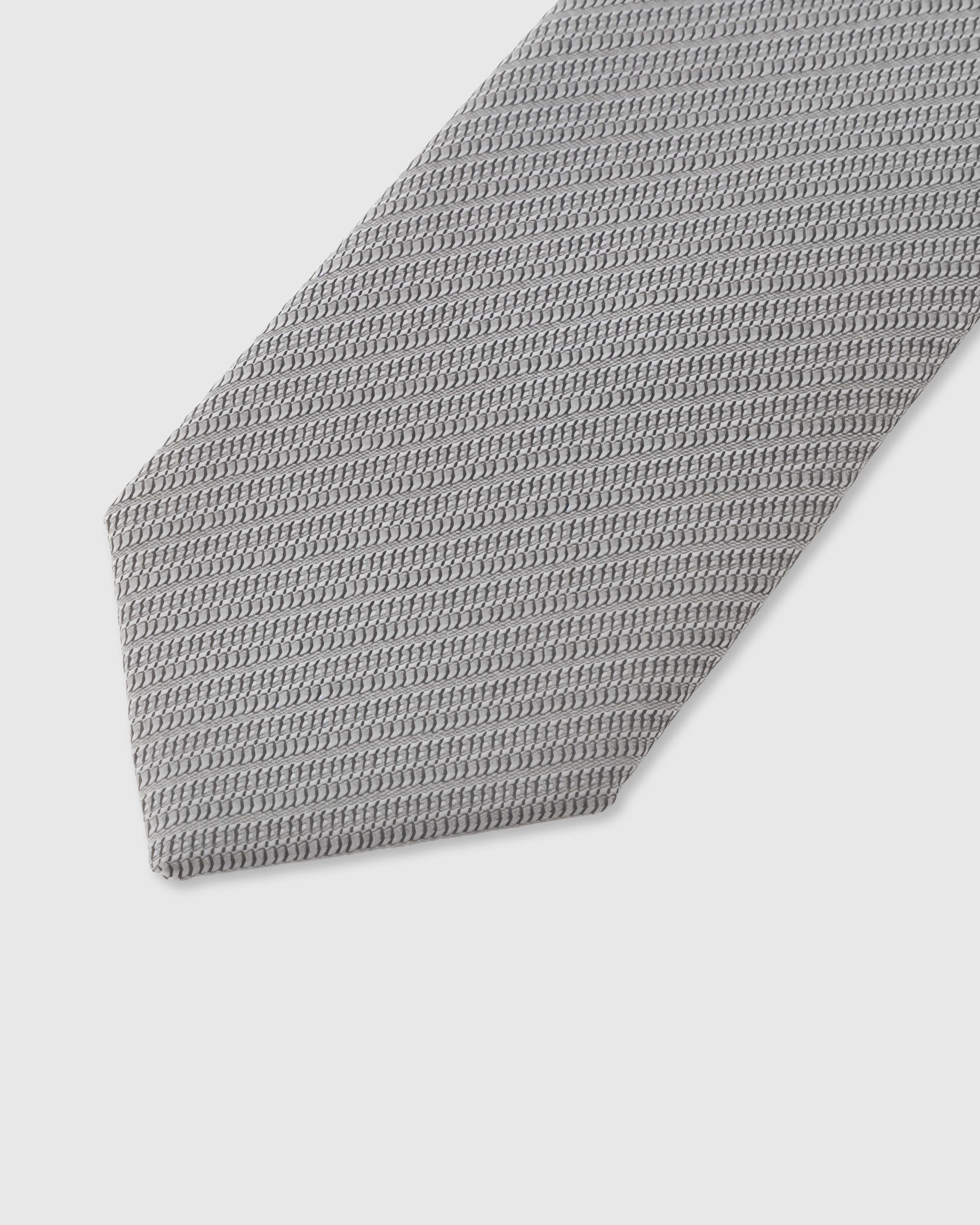 Micro-piqué weave detail on sterling grey mulberry silk tie showing surface texture by STICKYZOO