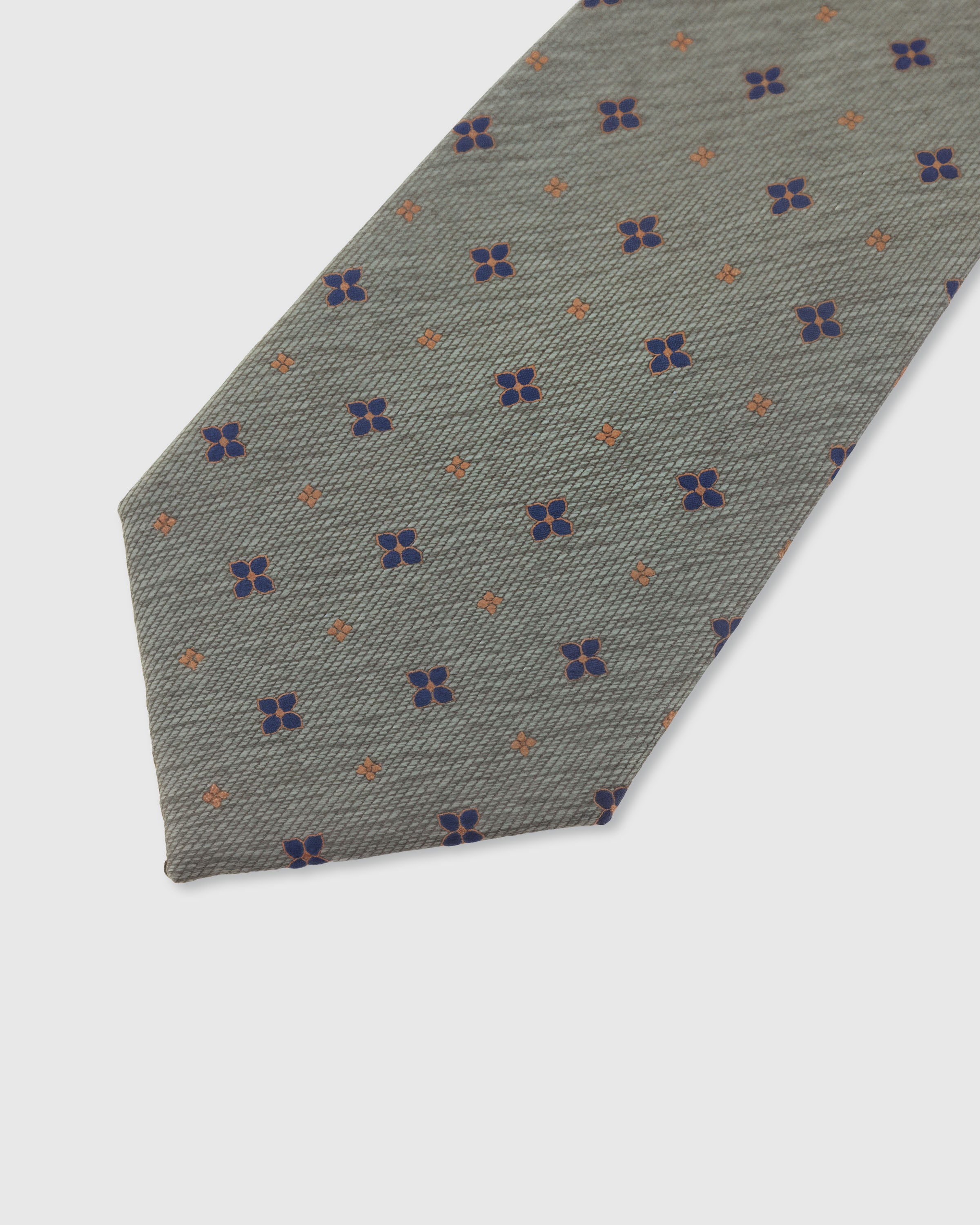 STICKYZOO Sage Floret Tie — detail of hand-embroidered scattered floret on pure mulberry silk