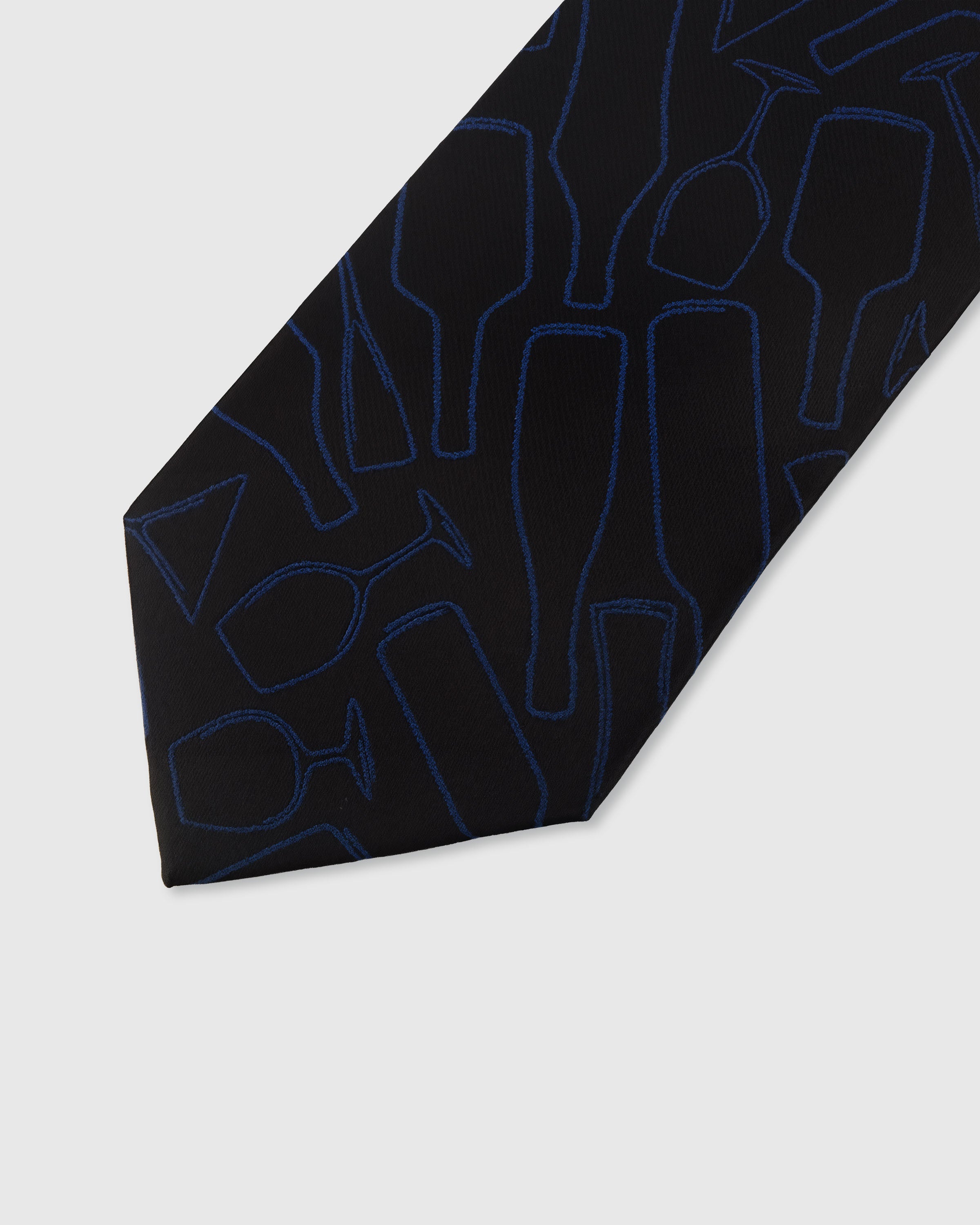 STICKYZOO MIDNIGHT BLUEPRINT TIE — hand-embroidered detail showing blue geometric line-art silhouettes, stitched not printed