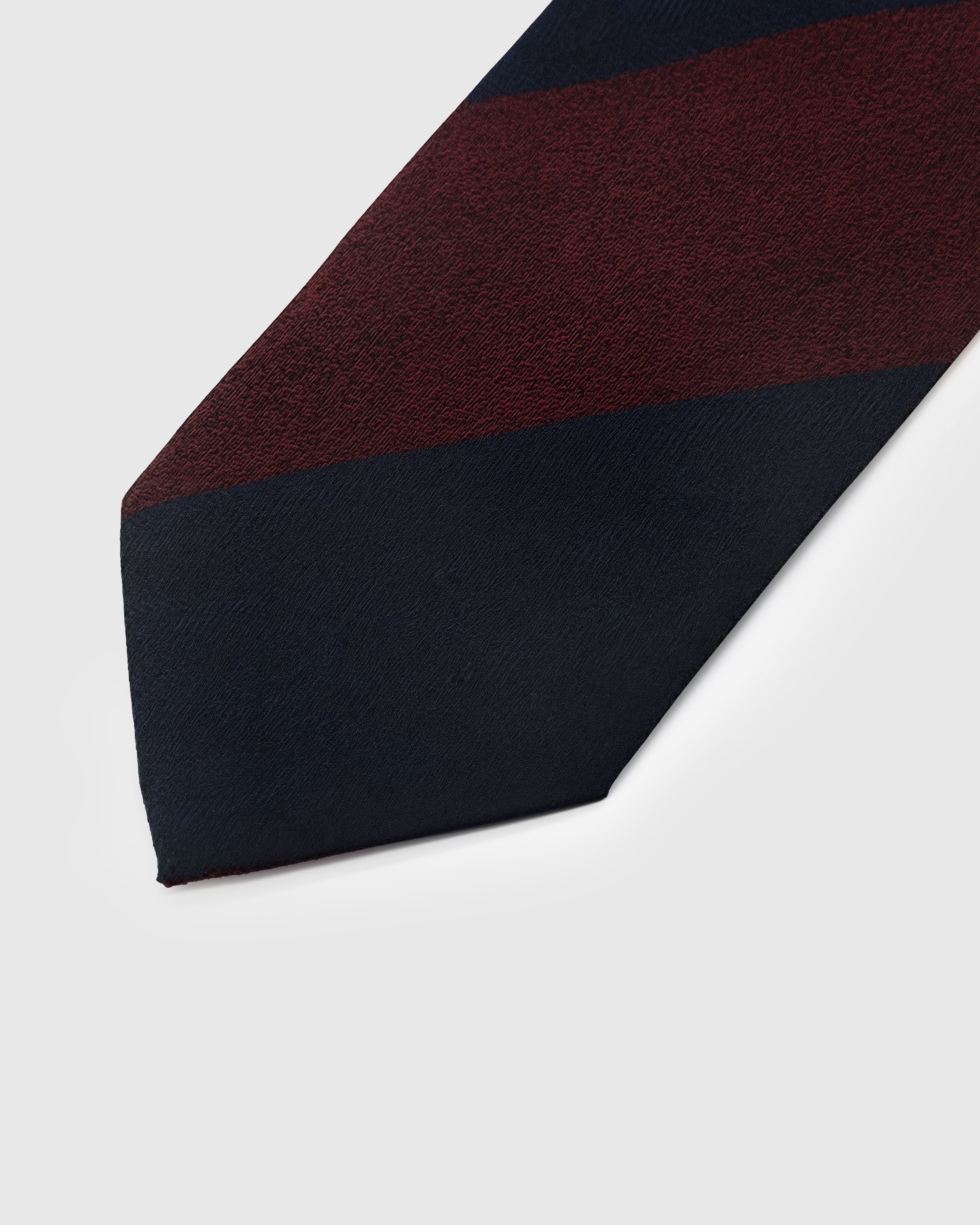 Claret and navy regiment stripe detail showing woven texture contrast on mulberry silk by STICKYZOO