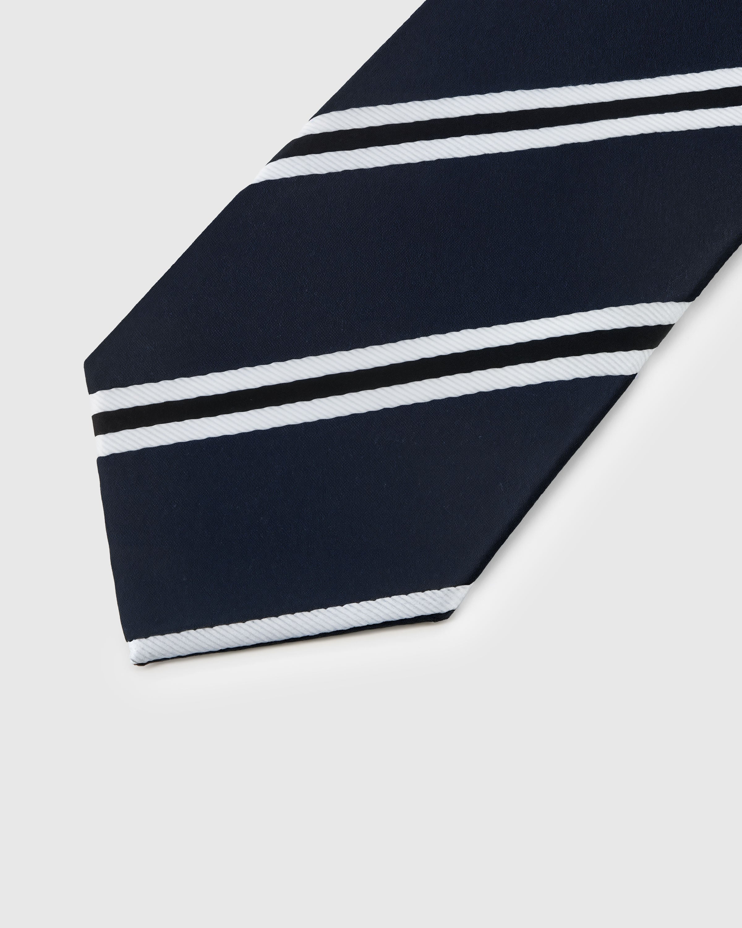 Emerald and white regimental stripe detail on navy mulberry silk tie showing woven color bands by STICKYZOO
