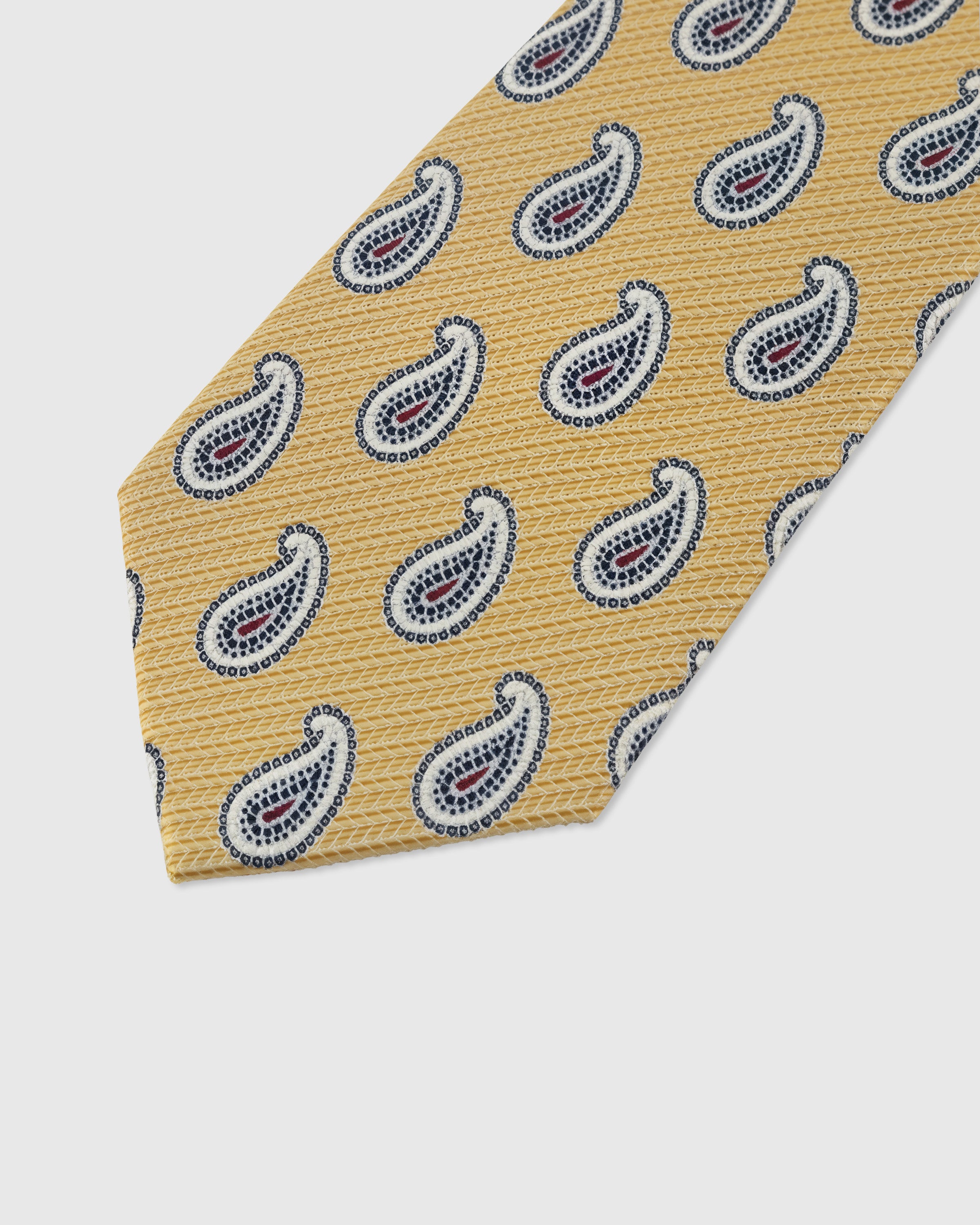 Paisley motif detail on saffron mulberry silk tie showing multi-color hand-embroidered stitching by STICKYZOO