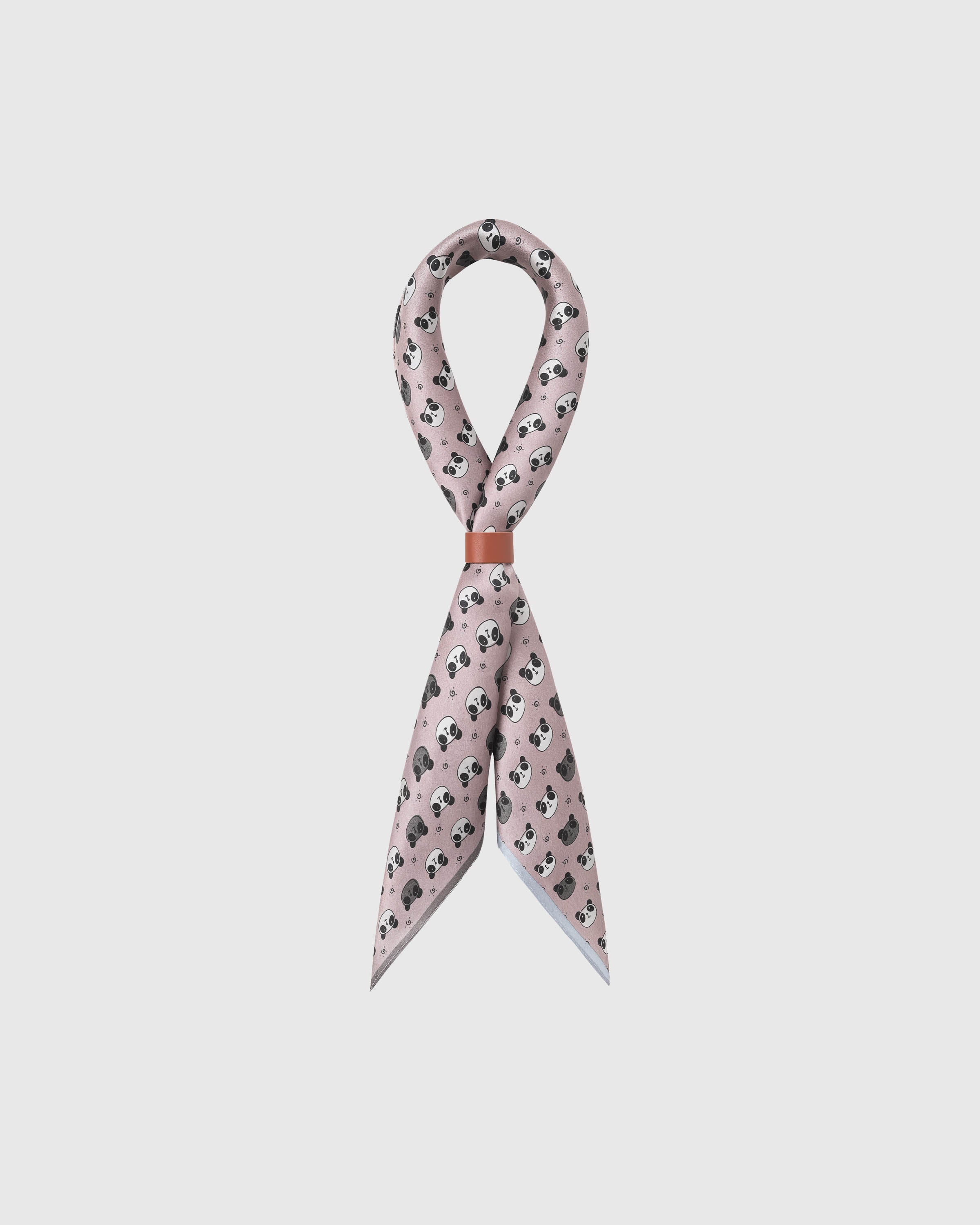 STICKYZOO blush panda silk scarf draped in a ribbon fold with a leather slide showing the panda print