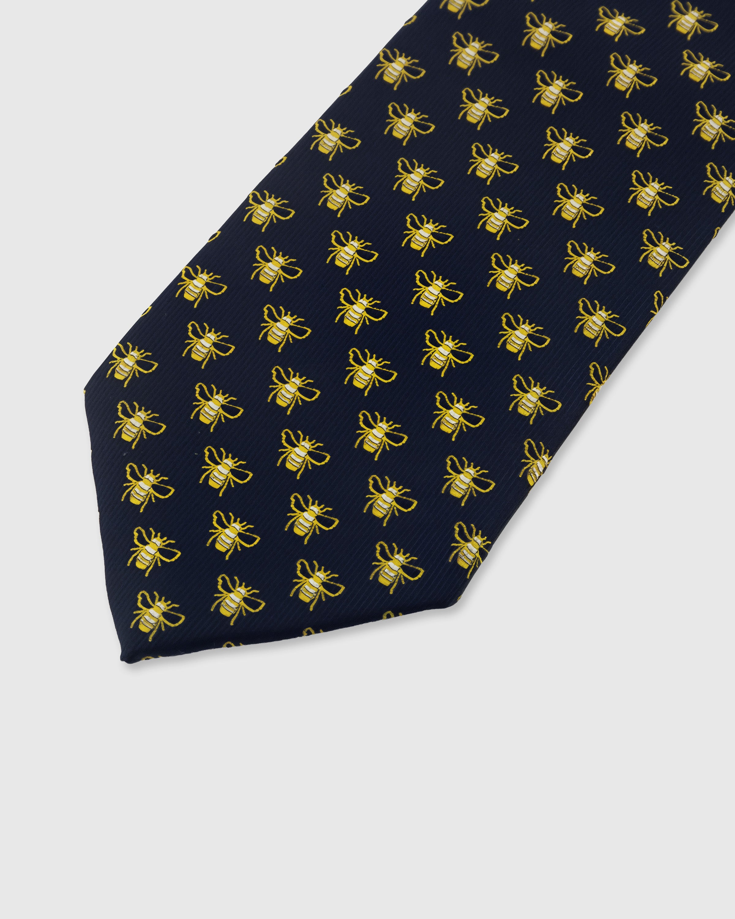 Gold bee detail on midnight mulberry silk tie showing hand-embroidered wing and body stitching by STICKYZOO