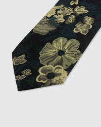 STICKYZOO NOIR BOTANICAL TIE — hand-embroidered detail showing gold-toned botanical blooms and foliage, stitched not printed