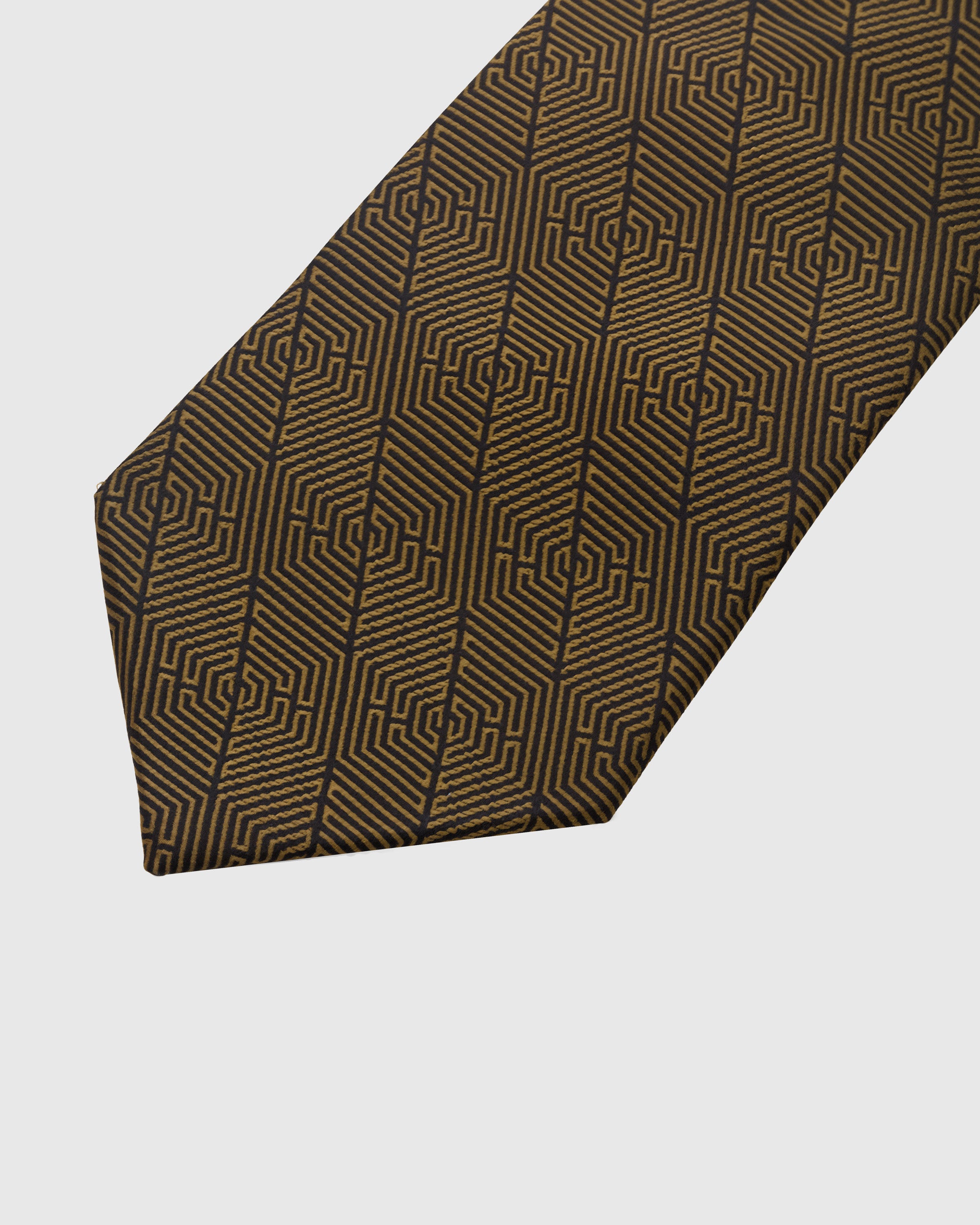 BRONZE GEOMETRIC TIE — 45° Italian bias-cut construction with structured interlining, hand-finished slip stitching visible on interior