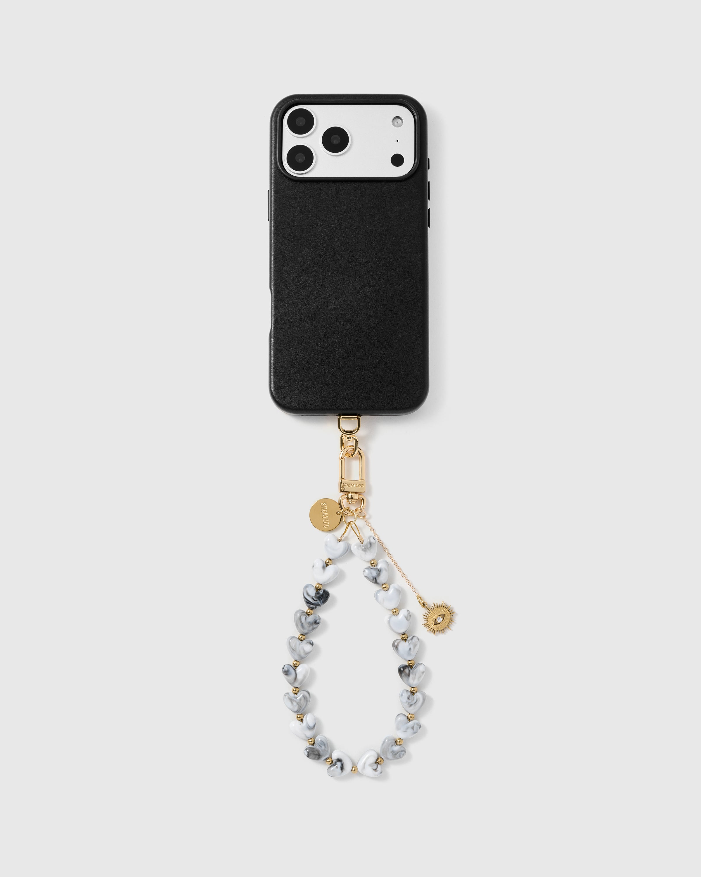 Storm grey heart phone strap worn as a wrist loop showing hands-free phone carry