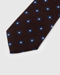 Navy square foulard motif detail on mocha mulberry silk tie showing hand-embroidered raised thread with white center by STICKYZOO