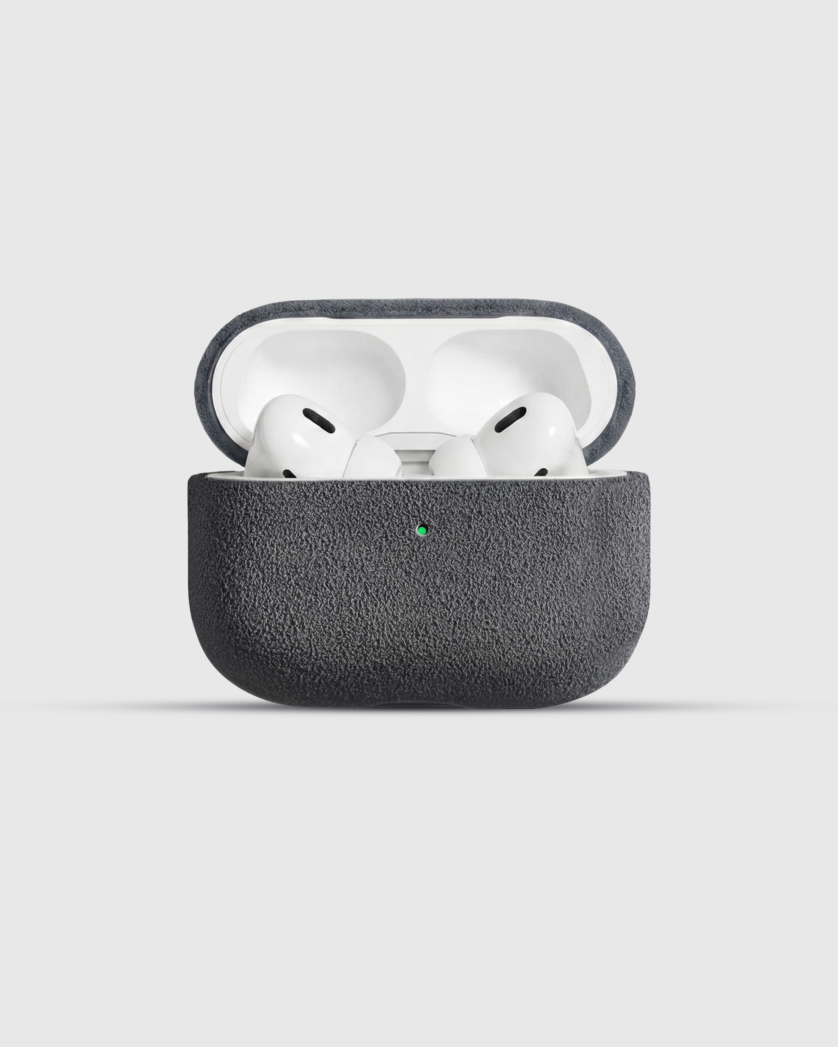 {{AirPods Pro fit securely.}} Charcoal Alcantara case open with AirPods Pro seated inside