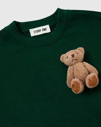 STICKYZOO Saint Teddy Bear Sweatshirt in forest green flat-lay showing cropped proportions