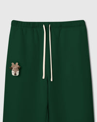 Close-up of plush reindeer head applique on white cotton showing miniature antlers and embroidered details