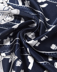 Close-up of the navy silk swirled to show the ivory line-work and the soft silk drape
```