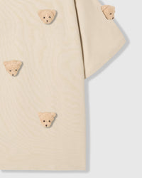 Detail of body and sleeve on STICKYZOO beige Bear T-Shirt showing plush bears at different angles