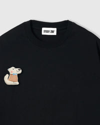 Close-up of plush scottie dog applique with miniature gingham vest on black cotton