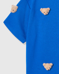 Detail of sleeve and body on STICKYZOO blue Bear T-Shirt showing plush bear faces at different angles