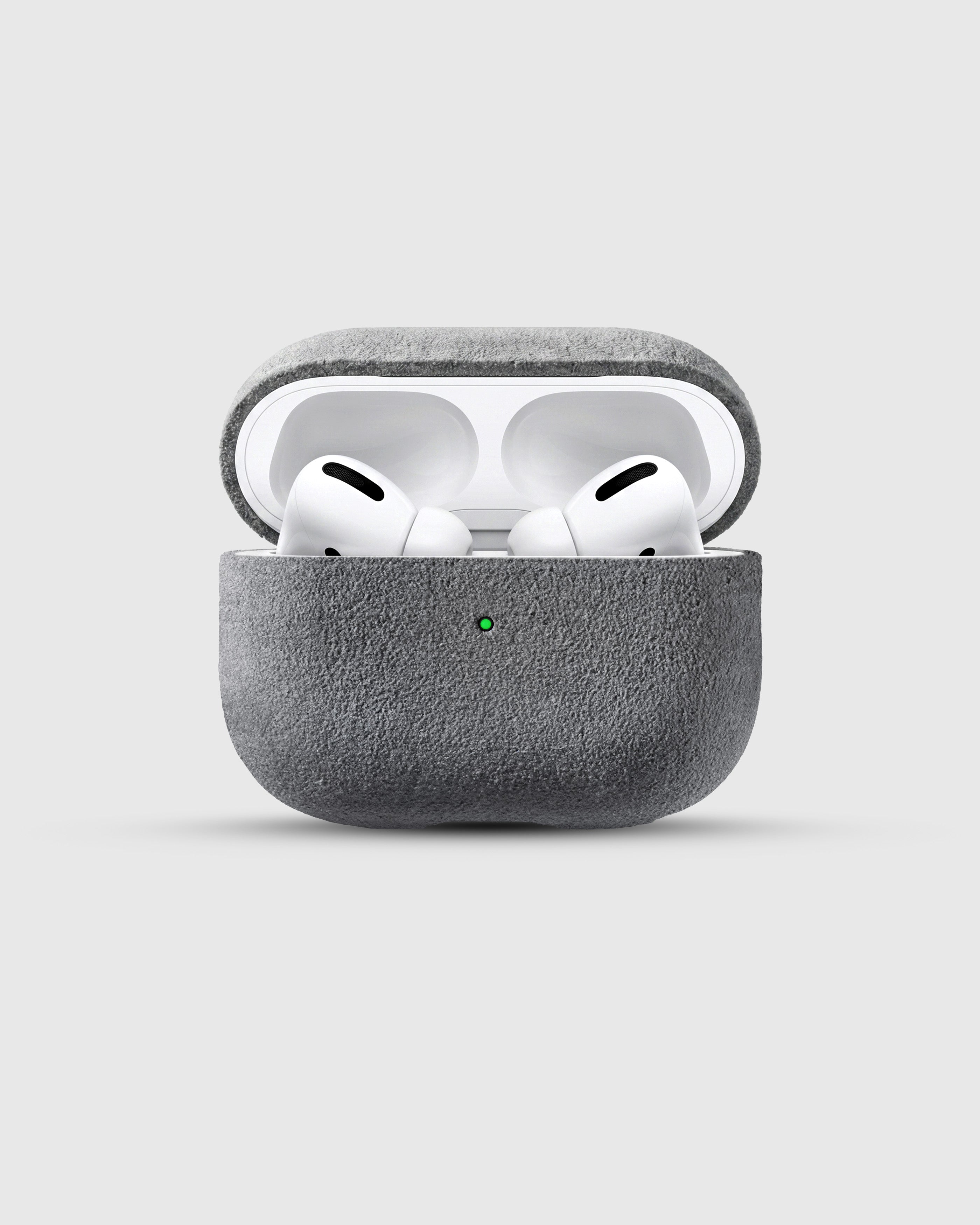 {{AirPods Pro fit securely.}} Ash Grey Alcantara case open with AirPods Pro seated inside