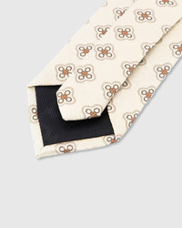 STICKYZOO Ivory Medallion Tie construction detail showing 45° bias-cut Italian method and structured interlining, rated 4.9 stars