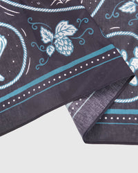 STICKYZOO campfire critters silk scarf showing the printed hop-vine border and stitched hem detail