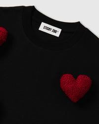 Alternate angle of Scattered Heart T-Shirt on model showing oversized proportions