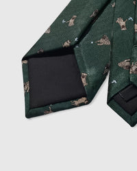 Hand-finished interior Pug Play Tie back view showing structured interlining and tipping on forest green herringbone silk