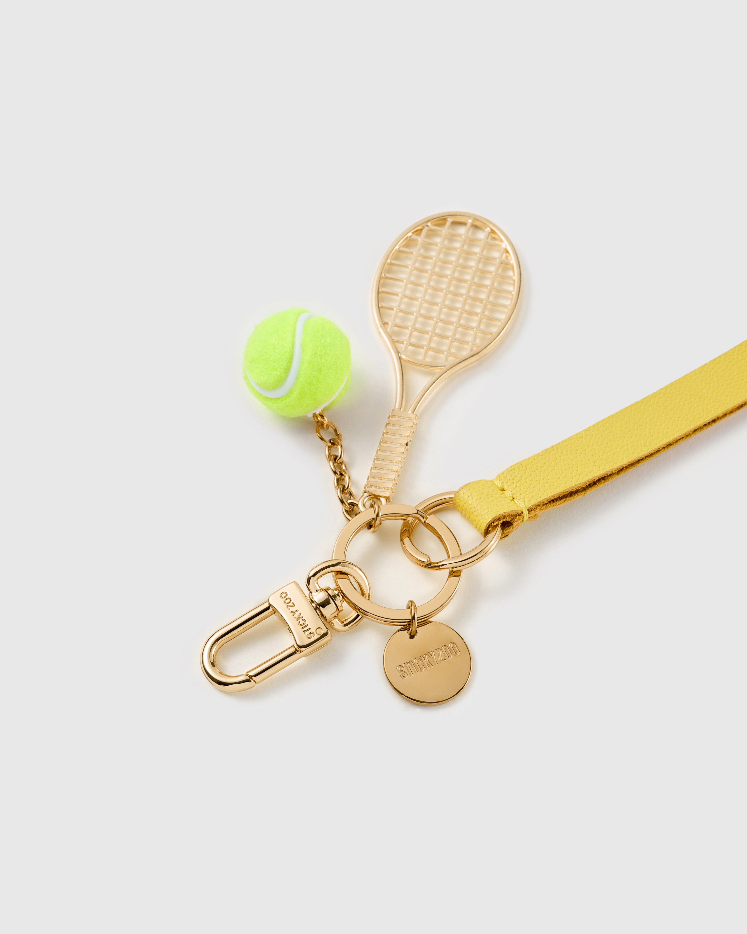 Saffron court leather phone strap clipped to a phone case showing the hands-free wrist loop in use
