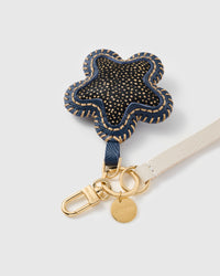 Close-up of the hand whip-stitched STICKYZOO spotted calf-hair star showing real hair-on texture and gold flecks
