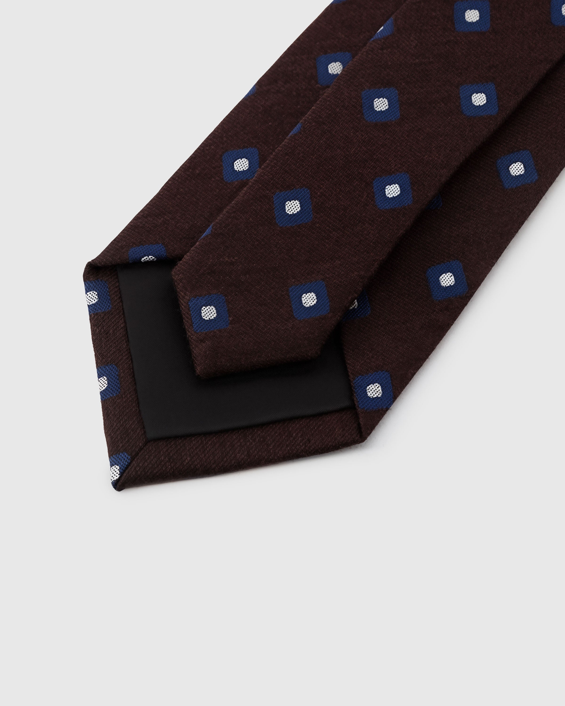 {{Structured interlining}} STICKYZOO Mocha Square Tie back detail showing black interlining and hand-finished construction, 145 × 8 cm