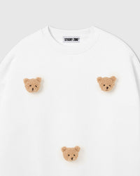 Model wearing STICKYZOO Sticky Bear Sweatshirt in white showing dropped shoulders and relaxed silhouette