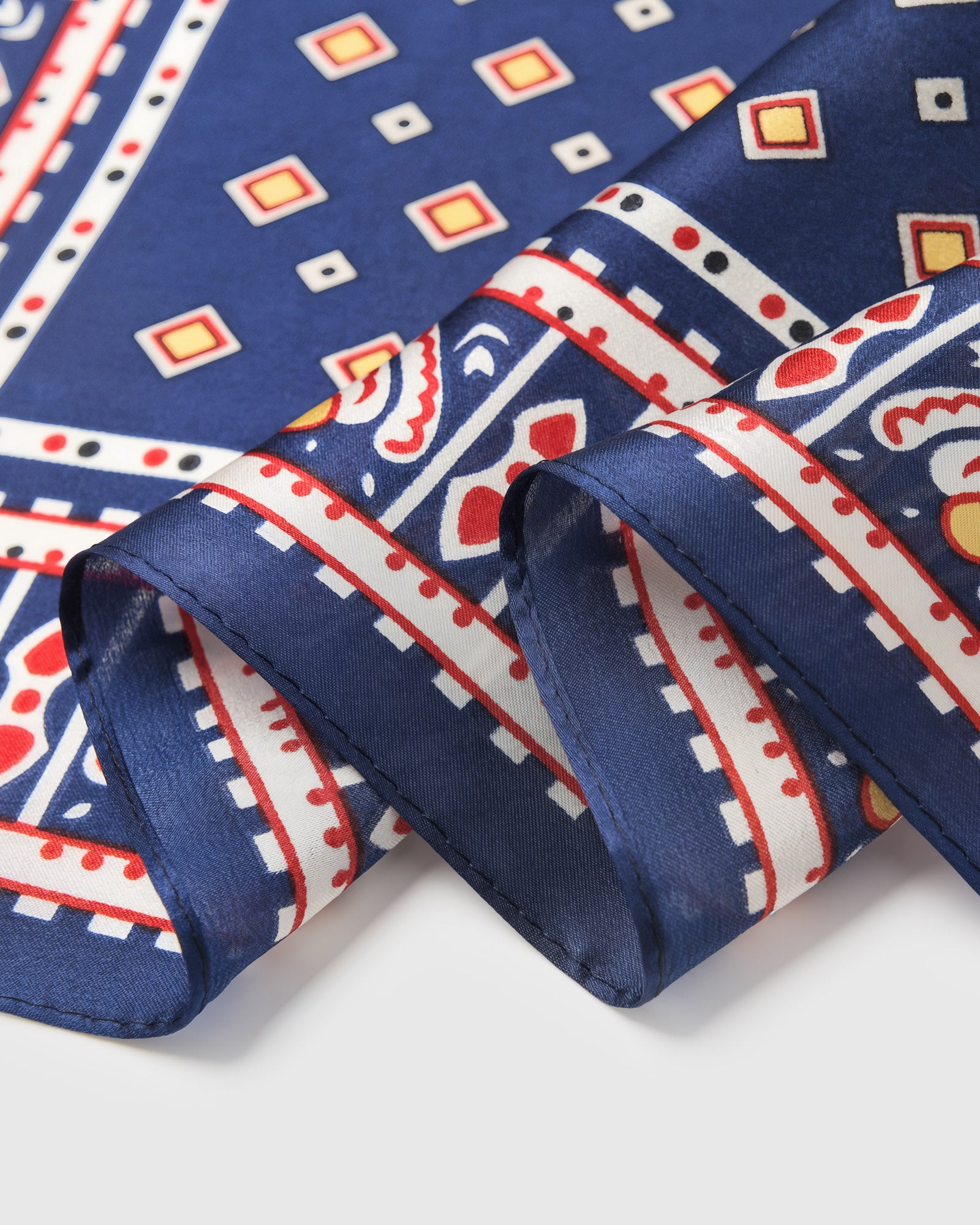 Close-up of the hand-illustrated tile border printed in archival inks on pure silk