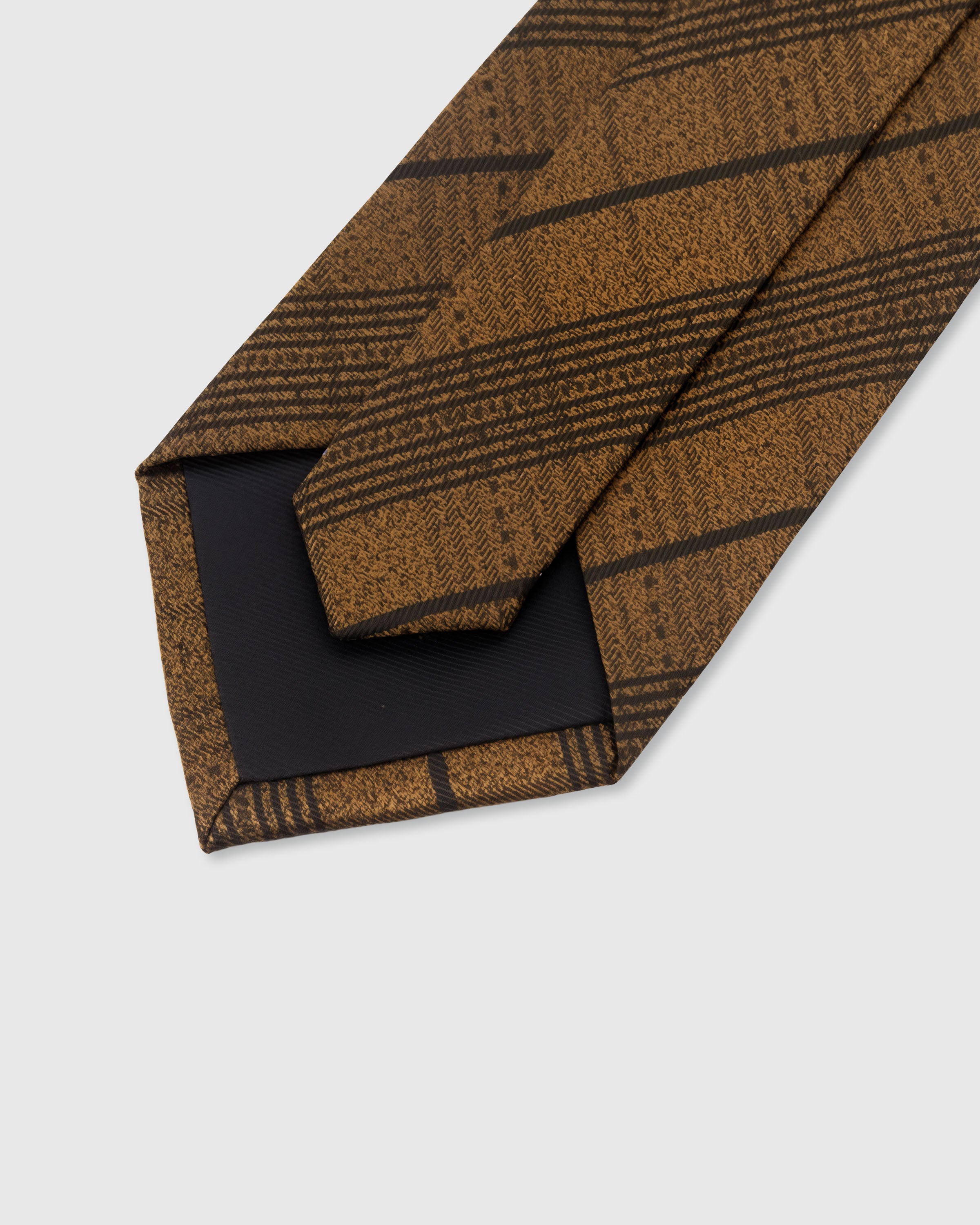 {Hand-finished interior} STICKYZOO AMBER HERRINGBONE STRIPE TIE back detail showing structured interlining and hand-finished slip stitching, 145 x 8 cm