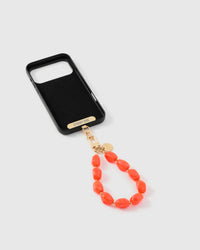 Inside of phone case showing STICKYZOO Phone Strap Card with coral agate strap attached