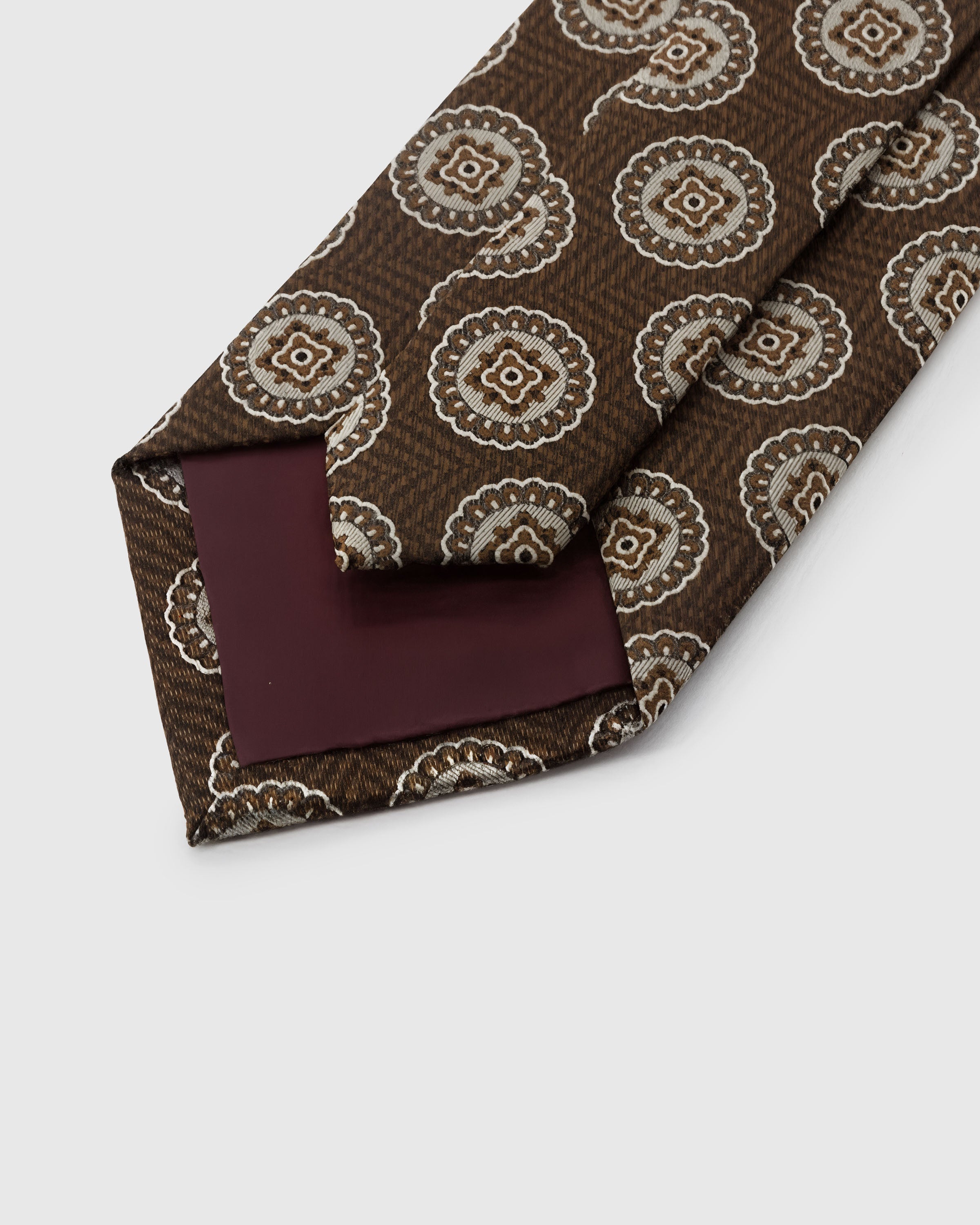 STICKYZOO Walnut Medallion Tie construction showing structured interlining and hand-finished slip stitching, 145 x 8 cm
