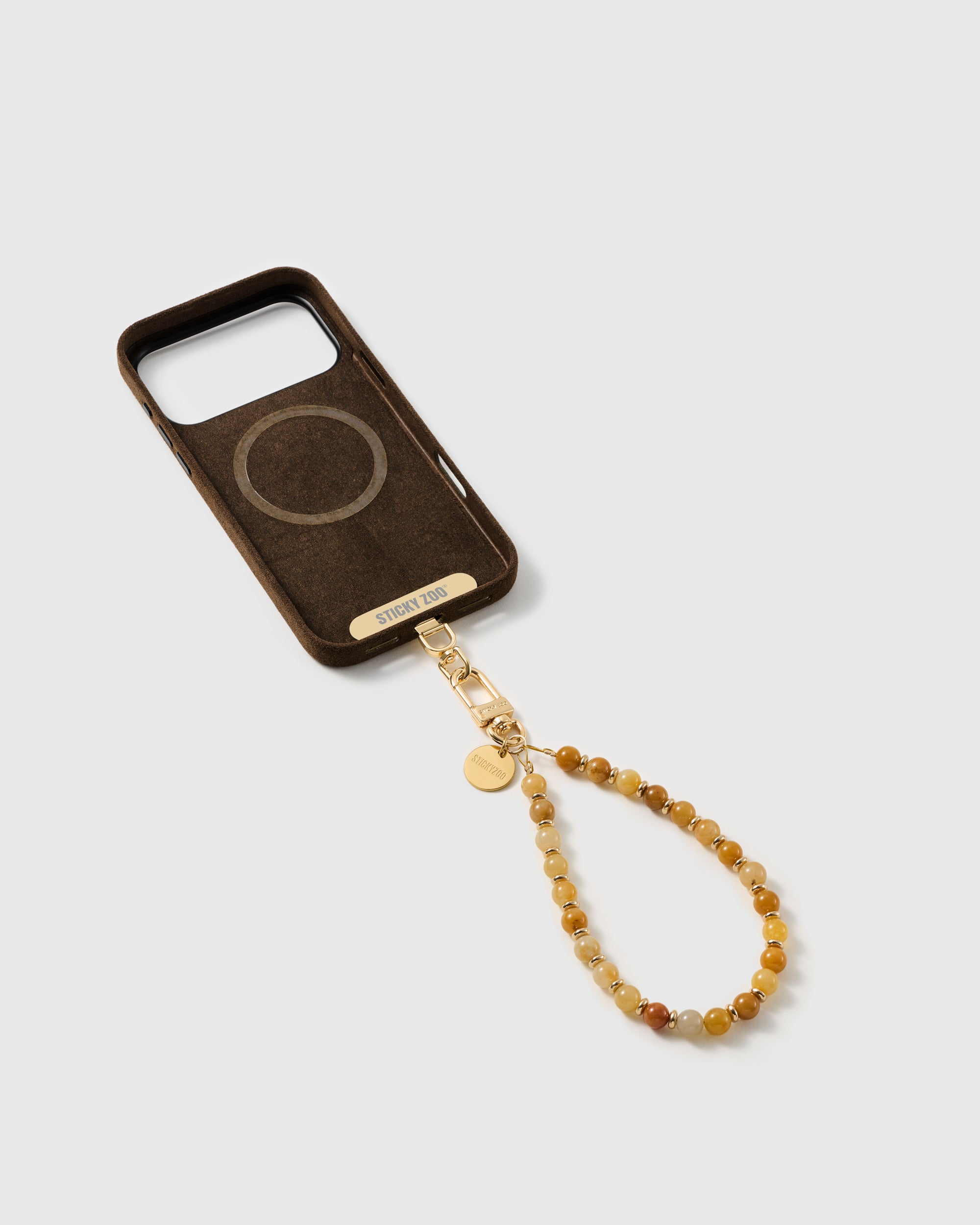 Inside of a phone case showing the included Phone Strap Card that lets the strap work with any case